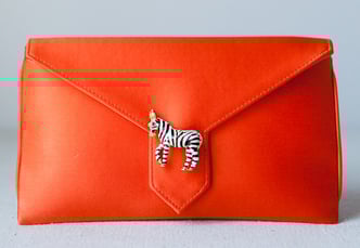 Red purse with zebra accent
