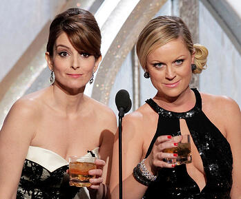 Tina Fey and Amy Poehler host the Golden Globes in 2013; photo by Paul Drinkwater