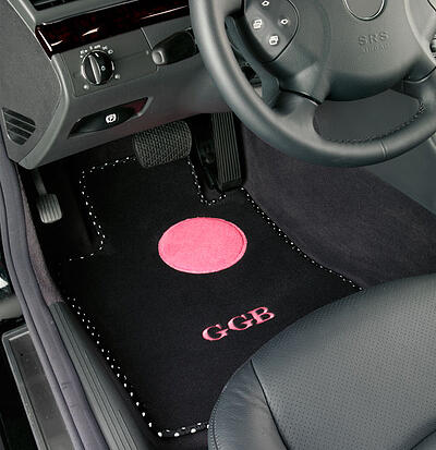 Custom car floor mat with pink accents and monogram