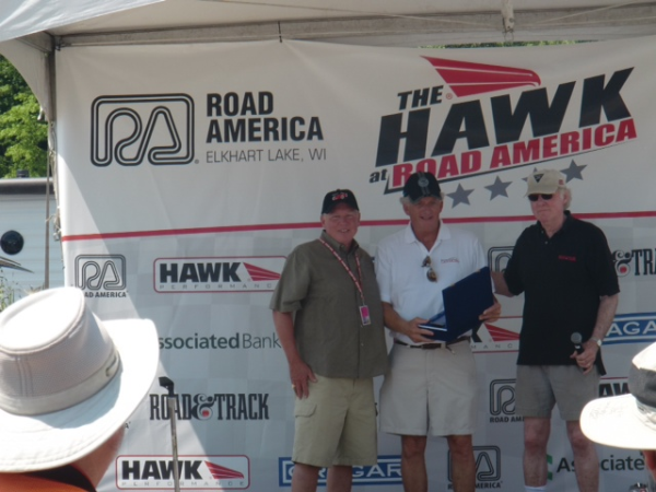 Bob Bailey (center) is awarded the Road & Track Magazine Award for The Car We'd Like to Race